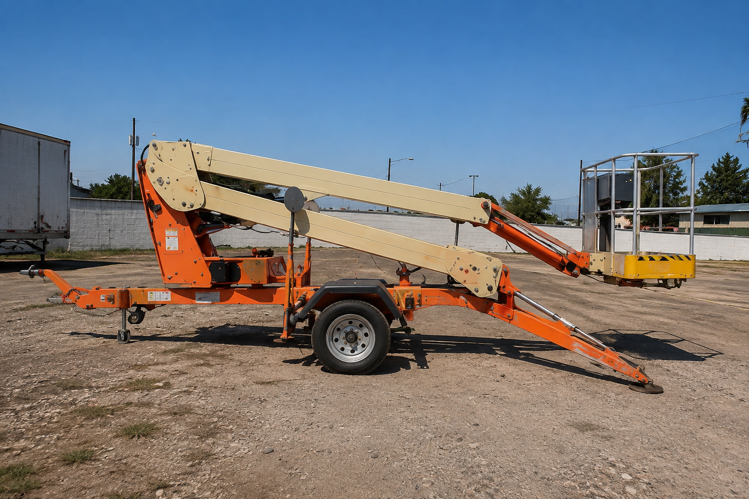Orange 35-foot bumper-pull manlift at the BNRB rental yard.