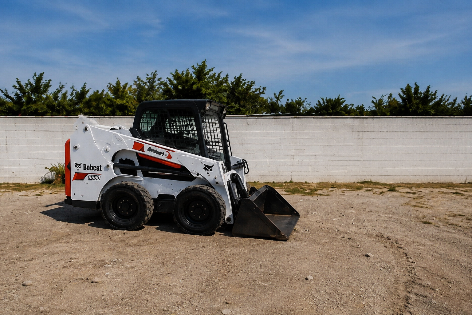 White Bobcat skid steer at the BNRB rental yard.
